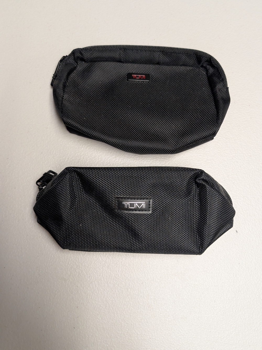 Tumi Black Nylon First Class Airline Pouches- Set of 2